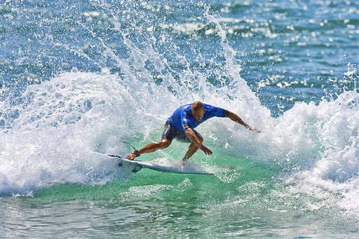 Kelly Slater pushing the tail all the way around.