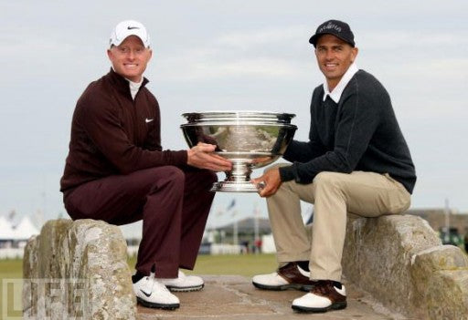 Kelly Slater and Simon Dyson Hold up their First Place Trophy aththe 'Afred Dunhill Links' golf course.