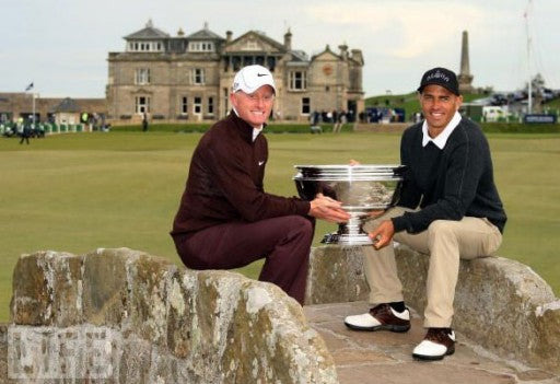 Kelly Slater and Simon Dyson Hold up their First Place Trophy aththe 'Afred Dunhill Links' golf course.